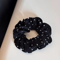 Detail shot of black pleated scrunchie with white polka dots showing fabric texture - Black-Small