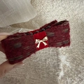 Close-up of wine red knitted banana hair clip with velvet ribbon and golden bow detail - Red Gold Knot Banana Clip - Striped Tweed