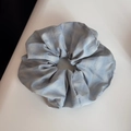 Close-up of light blue plaid scrunchie hair tie showing cotton fabric texture and pattern - Blue Series Scrunchie - Light Large Plaid