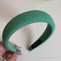 Detail of emerald green sponge headband featuring a woven handmade label and fabric texture - Spring Green Wide Headband-Emerald Green
