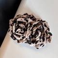 Detail of leopard print fabric flower hair clip with layered pleated fabric texture - Leopard Print Double Flower Banana Clip