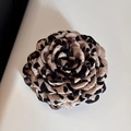 Detailed macro view of a leopard print fabric rose hair clip with rich layered petals - Leopard Print Large Flower Claw Clip
