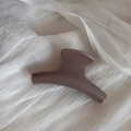 Elegant morandi purple hair claw clip detail on a white textured fabric background - Khaki