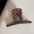 Detailed view of leopard print hair claw clip with glossy finish on grey background - Coffee Leopard - Short Bar Shape