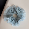Close-up of light blue polka dot scrunchie with lace edge and soft fabric texture - Sweet Blue - Lace Edge Tie