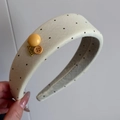 Detail of cream lace scrunchie with black polka dots and hand made metal charm - Sweet Yellow - Button Headband