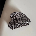 Detail shot of heart-shaped leopard print hair claw clip in dark grey and black resin - Gray Leopard Small Heart Claw