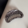 Detailed macro view of moon-shaped hair claw clip with grey leopard print and glossy finish - Gray Leopard Hollow Crescent Claw