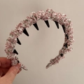 Detail showing the floral fabric texture and black toothed inner comb of the hairband - Pink Floral Pastoral Headband