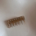 Detailed macro view of amber translucent resin hair comb with sparkling rhinestones decoration - Mermaid Grey-White (FJ89930)