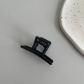Top-down view of a minimalist black geometric hair claw clip with a strong metal spring - Straight Line (4.5cm) / Black