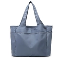 Detailed front view of grey-blue large capacity tote bag with front slip pockets - Blue