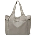 Close-up of a large grey nylon travel tote featuring multiple pockets and durable handles - Gray