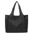 Detailed view of the large capacity black nylon tote bag with front V-stitch pocket - Black