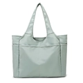 Détail du sac de voyage en nylon vert clair avec poche frontale et compartiments latéraux - Vert