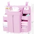 Pink hanging crib organizer with multiple compartments for diapers and baby bottles - 14x50x58cm / Pink