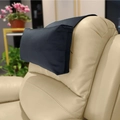 Detail of blue velvet headrest with adjustable non-slip strap on a leather sofa chair - Black