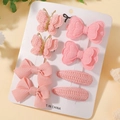 Détail du lot de 8 barrettes roses pour enfants avec nœuds et papillons sur carte - Rose (8F)