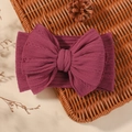 Elastic baby headband with large dark pink knit bow and jacquard cable texture - Deep Pink