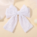 Dettaglio del fiocco con paillettes bianche e nastri per accessori festa bambina - Bianco (20)