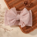 Light pink baby headband featuring a large cable knit bow and soft elastic wide ribbing - Light Pink