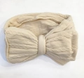 Beige cable knit baby headband featuring a large bow and soft elastic jacquard texture - Beige