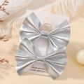 Set of two silver faux leather bow hair clips for children on white display card - Silver Two-Piece Set (2A-11R)