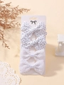 Set di quattro fermagli per capelli con fiocchi in pizzo e pois su cartoncino bianco - Stile Misto Pois e Pizzo / Mix Pois e Pizzo (4B)