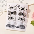 Set di 10 fermagli per capelli per bambini in tessuto bianco e nero con fiocchi e quadri - 10E Set Nero Bianco Plaid