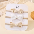 Set of 3 warm beige baby nylon headbands with lace and ribbed fabric bows on card - Warm Beige Style (3G)
