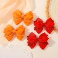 Set of 4 handmade glitter layered bow hair clips in orange and red grosgrain ribbon - 4C