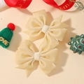 Pair of cream velvet hair clips with double-layered bow design for festive children's wear - Off White