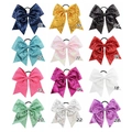 Detail view of twelve multi-colored sequin bow hair ties with elastic bands in grid layout - Multicolor Mixed