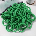 High-elastic candy green nylon hair ties for kids, stacked in bulk on a white tabletop - 20 Pieces Set / Green (38)
