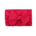 Detail of magenta cable knit baby headband with a large bow on white background - Rose Red (36)