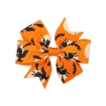 Detail of Halloween hair clip with orange ribbon showing witch and bat patterns - Orange Witch Moon Print (4)