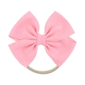 Close-up of bright pink ribbed fabric bow on a soft nude elastic nylon baby headband - Bright Pink (43)