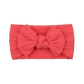 Detailed macro view of coral red baby headband with jacquard knit and soft bow accent - Coral Red (14)
