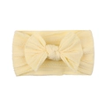 Detail view of baby cable knit headband with large bow in soft pale yellow nylon fabric - Pale Yellow (21)