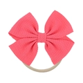 Detailed macro view of pink bow headband with waffle texture fabric and nude nylon band - Pink (21)