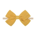 Close-up of bright yellow textured linen bow headband with soft nude elastic nylon band - Bright Yellow Bow (43)