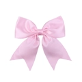 Detail of pink satin bow hair clip with silky texture and smooth metallic luster finish - Pink