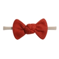 Detail view of the red waffle texture knit bow and high-elastic band for baby girls - Red (12)