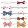 10-piece infant bow headband set with nylon bands in velvet floral and lace fabrics - Multicolor Pack