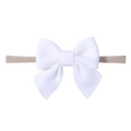 Close-up of white soft fabric bow attached to a high-elastic nude nylon baby headband - White