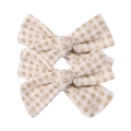 Detail of floral checkered fabric bow clips featuring small daisies and linen texture - Beige Gingham with Daisy