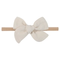 Detailed view of handmade cream fabric bow on a soft brown nylon baby headband - Cream (21)