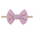 Detailed texture of dusty pink velvet bow on a soft nude nylon baby headband - Lotus Pink (25)