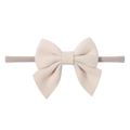 Soft cream bow headband for babies made with premium textured fabric and nylon strap - Off White