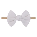 Detail view of a white linen bow with soft nylon elastic headband for infants - White (18)
